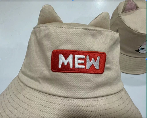 A decorated hat for a brand named Mew